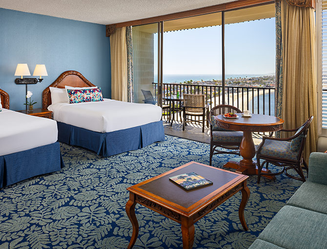 Studio room at the Catamaran Resort Hotel with two queen beds and balcony with views of Pacific Beach.