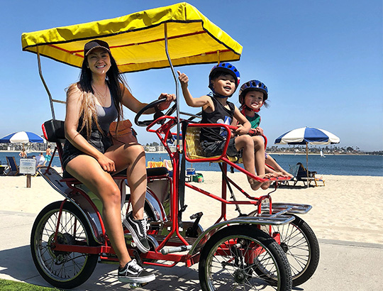Family enjoying bike riding on Mission Bay