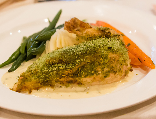 Plated chicken dinner with beans, carrots and mash potatoes at the Catamaran