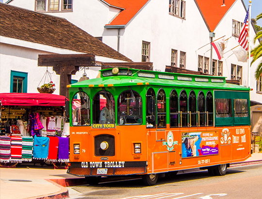 Old Town Trolley making a stop at Old Town San Diego on the hop on and off tour