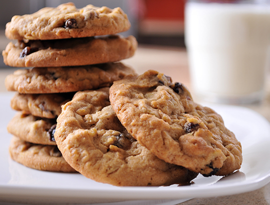 Stack of cookies with glass of milk