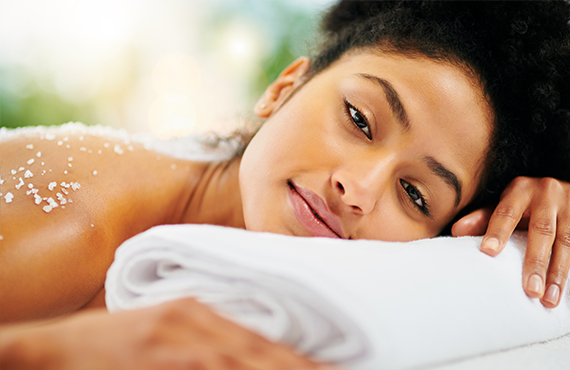 woman relaxing during a body scrub treatment