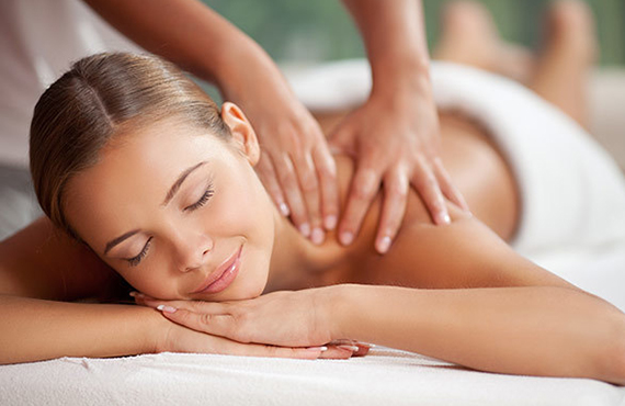 Woman enjoying a massage at the Catamaran Spa