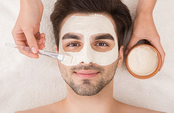 Man enjoying a facial at the Catamaran Spa