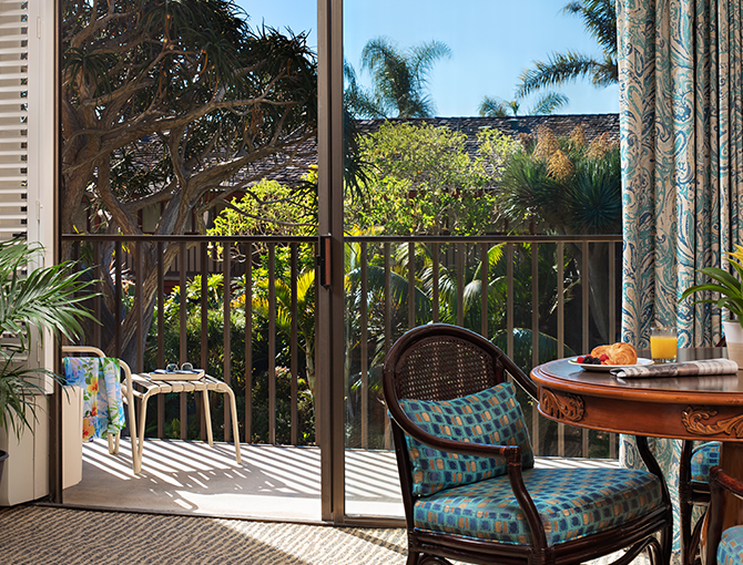 Dining in the Garden View Suite with views of the lush tropical gardens from the private balcony at the Catamaran Resort Hotel.