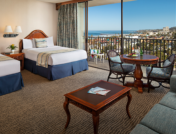 Studio room at the Catamaran Resort Hotel with two queen beds and balcony with views of Pacific Beach.