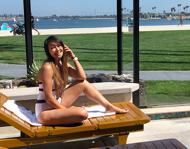 Woman outside relaxing a The Catamaran Spa private hot tub