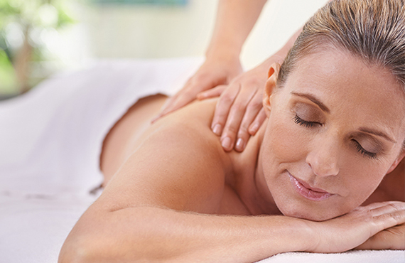 Woman enjoying a massage at the Catamaran Spa