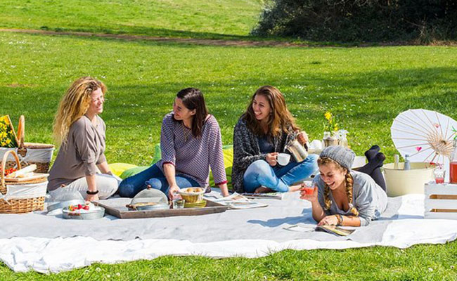 Girlfriends enjoying a picnic on Galentine’s Day