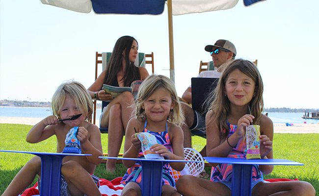 Family enjoying the outdoors on their workation at the Catamaran Resort Hotel