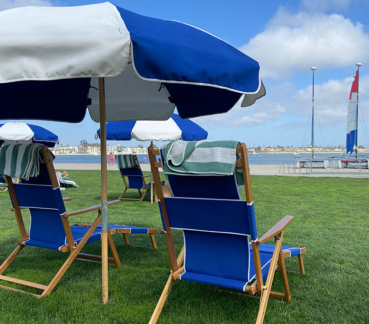 Beach chairs and umbrellas overlooking Mission Bay