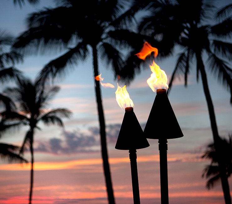 Tiki torches on Mission Bay at the Catamaran Resort Hotel