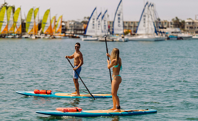 Stand Up Paddling on their couple's trip to San Diego