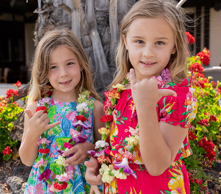 Girls at the Catamaran Resort Hotel showing off the leis they made during the fall resort activities.