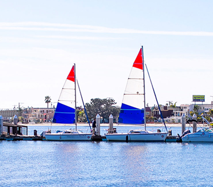Sail boats at the dock in Mission Bay at the Catamaran Resort Hotel in San Diego.