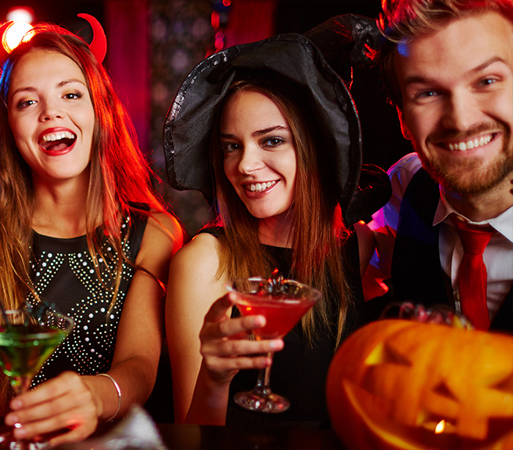 Party goers celebrating Halloween in costume on a sightseeing cruise through Mission Bay.