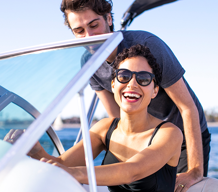 Young couple riding speedboat on Mission Bay