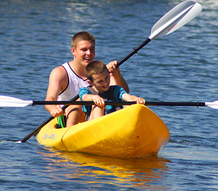 Young boys kayaking on Mission Bay