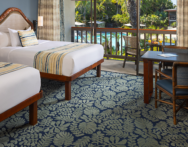  Interior poolside room on the second floor with two queen beds at the Catamaran Resort Hotel and Spa looking out to the pool.