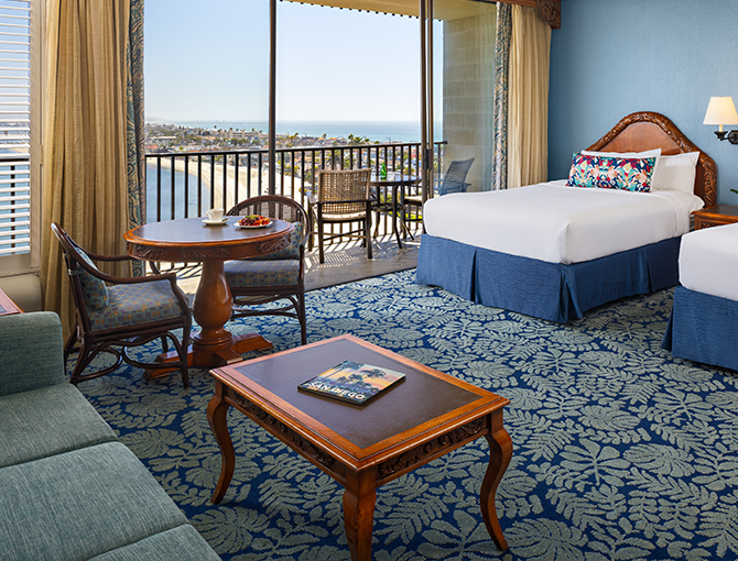 Studio room with two queen beds with views of Mission Bay from the balcony at the Catamaran Resort Hotel in the San Diego beaches area.