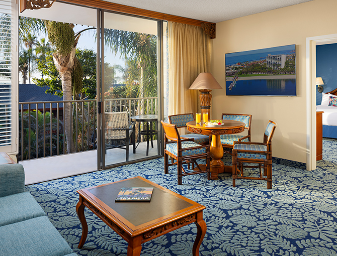 Living room space in the Garden View Suite with views of the tropical gardens at the Catamaran Resort Hotel.