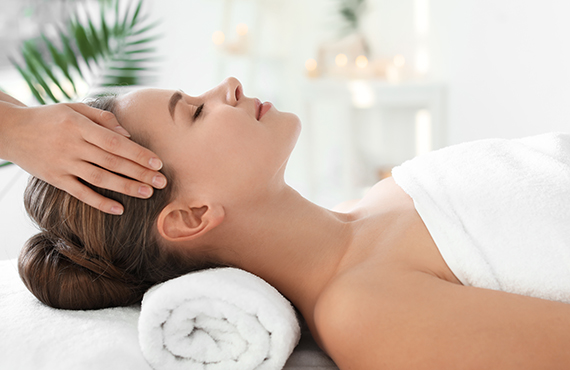 Woman enjoying a massage at the Catamaran Spa