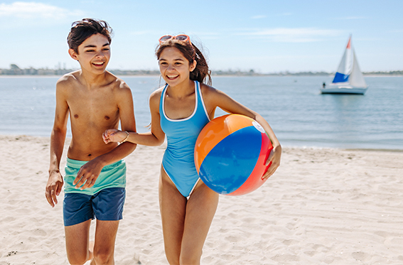 Kids having fun on the beach during Kids Free October at the Catamaran Resort Hotel in San Diego