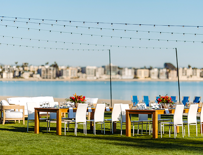 Bench seating on the lawn overlooking Mission Bay