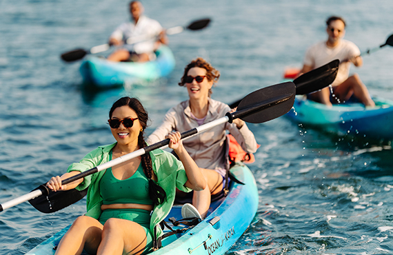 Group enjoying kayaking at the Catamaran Resort Hotel