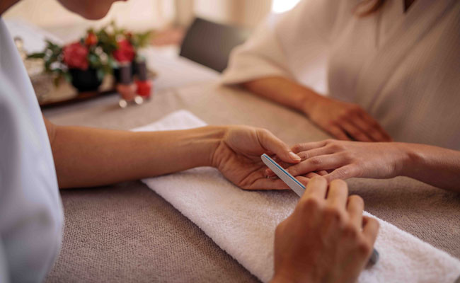Guest getting a Manicure at the Spa at The Catamaran Resort Hotel and Spa in San Diego, CA