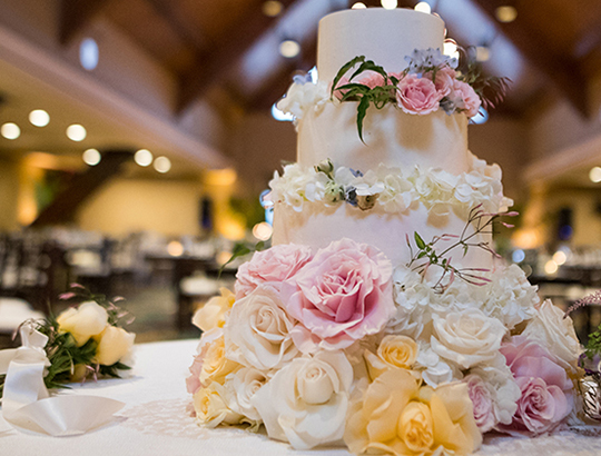 Wedding cake with a custom spray of flowers