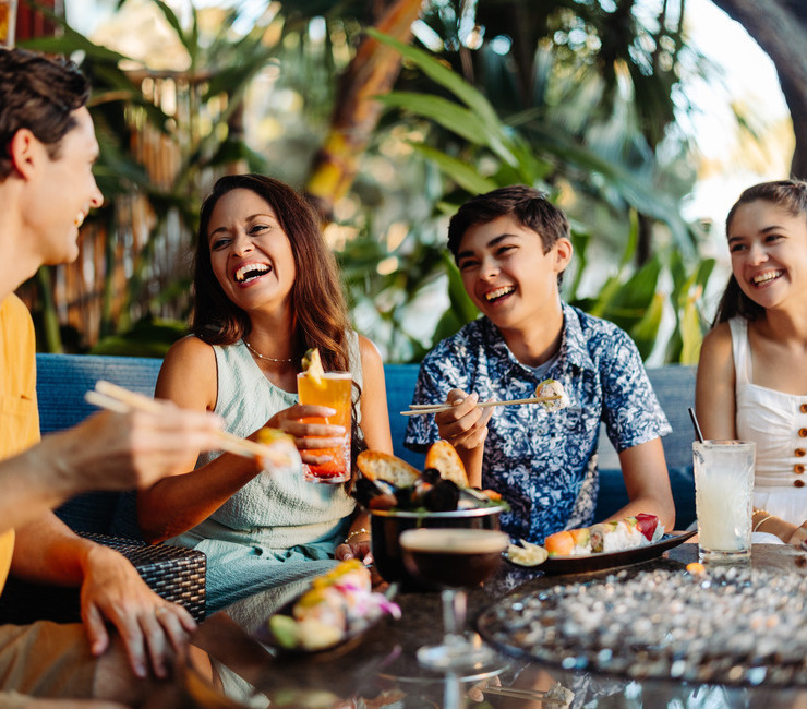 Family enjoying happy hour at Moray's