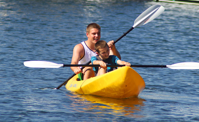 Young boys kayaking on Mission Bay