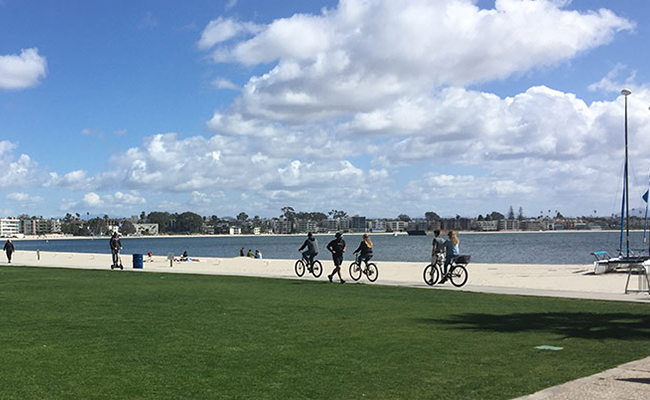 Local enjoying the walkway on Mission Bay change to Locals enjoying the boardwalk on Mission Bay