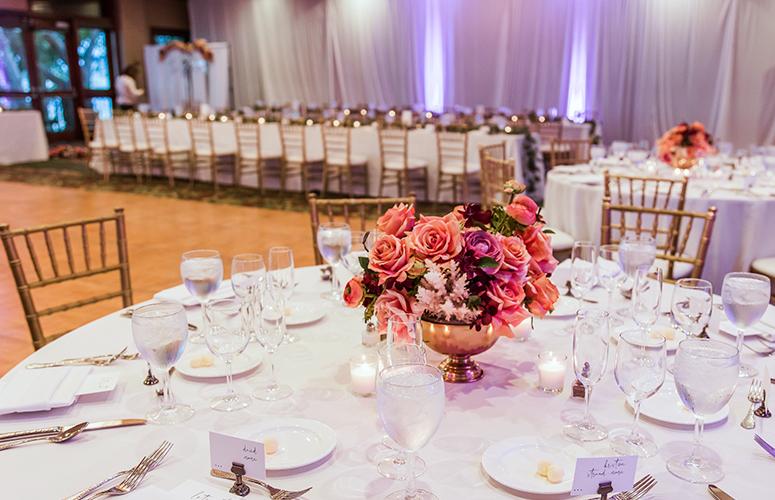 Reception featuring a layout of round and rectangular table setting for Jordan and Derrace’s wedding at the Catamaran Resort Hotel in San Diego.