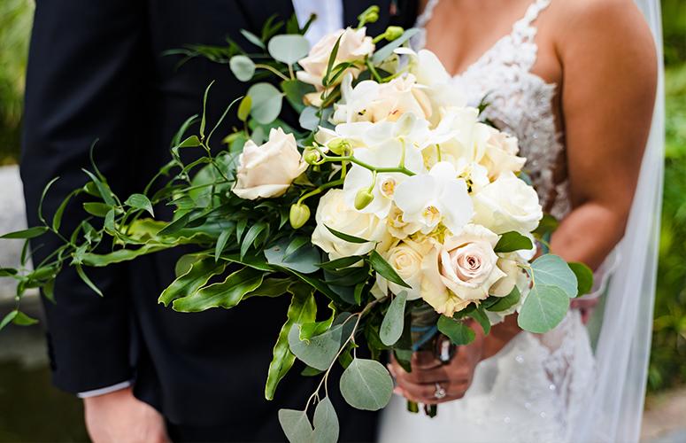 A classic wedding bouquet of white roses.